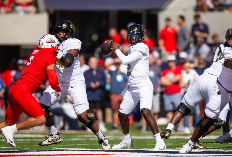 Oct 19, 2024; Tucson, Arizona, USA; Colorado Buffalos quarterback Shedeur Sanders (2) against the Arizona Wildcats in the first half at Arizona Stadium. Mandatory Credit: Mark J. Rebilas-Imagn Images