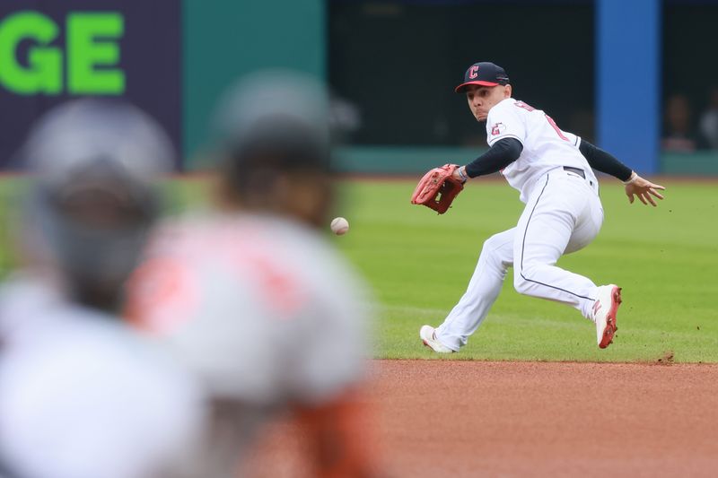 Sep 24, 2023; Cleveland, Ohio, USA; Cleveland Guardians second baseman Andres Gimenez (0) fields a ball hit by the Baltimore Orioles third baseman Gunnar Hendersen (2)during the first inning at Progressive Field. Mandatory Credit: Aaron Josefczyk-USA TODAY Sports