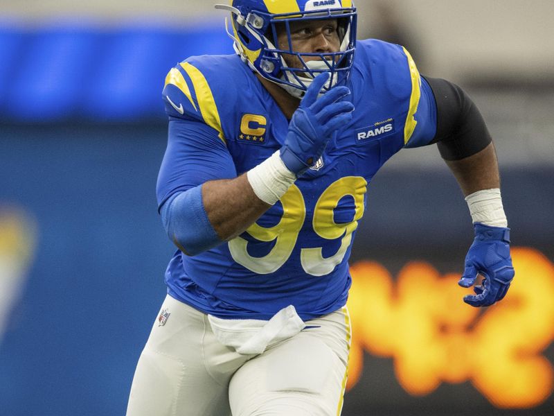 Los Angeles Rams defensive tackle Aaron Donald (99) runs during an NFL football game against the Washington Commanders, Sunday, Dec. 17, 2023, in Inglewood, Calif. (AP Photo/Kyusung Gong)