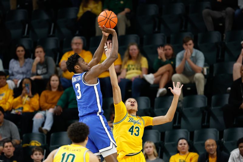 Feb 10, 2026; Waco, Texas, USA;  BYU Cougars forward AJ Dybantsa (3) scores a basket against Baylor Bears guard Cameron Carr (43) during the first half at Paul and Alejandra Foster Pavilion. Mandatory Credit: Chris Jones-Imagn Images