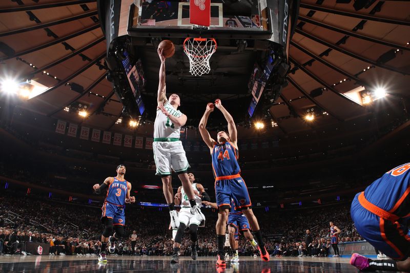 NEW YORK, NY - FEBRUARY 24: Payton Pritchard #11 of the Boston Celtics drives to the basket during the game against the New York Knicks on February 24, 2024 at Madison Square Garden in New York City, New York.  NOTE TO USER: User expressly acknowledges and agrees that, by downloading and or using this photograph, User is consenting to the terms and conditions of the Getty Images License Agreement. Mandatory Copyright Notice: Copyright 2024 NBAE  (Photo by Nathaniel S. Butler/NBAE via Getty Images)