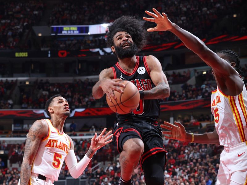 CHICAGO, IL - APRIL 17:  Coby White #0 of the Chicago Bulls goes to the basket during the game against the Atlanta Hawks during the 2024 Play-In Tournament  on April 17, 2024 at United Center in Chicago, Illinois. NOTE TO USER: User expressly acknowledges and agrees that, by downloading and or using this photograph, User is consenting to the terms and conditions of the Getty Images License Agreement. Mandatory Copyright Notice: Copyright 2024 NBAE (Photo by Jeff Haynes/NBAE via Getty Images)