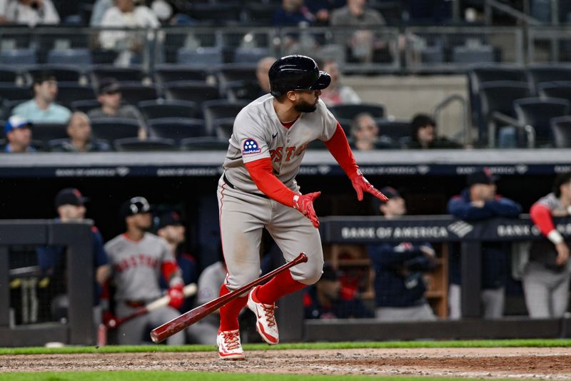 Jun 8, 2025; Bronx, New York, USA; Boston Red Sox first baseman Abraham Toro (29) hits a RBI double against the New York Yankees during the ninth inning at Yankee Stadium. Mandatory Credit: John Jones-Imagn Images