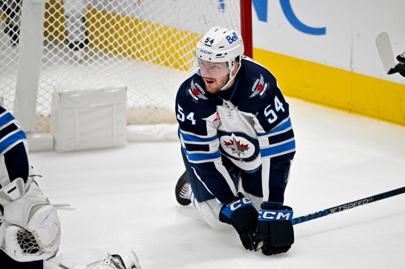 Apr 11, 2024; Dallas, Texas, USA; Winnipeg Jets defenseman Dylan Samberg (54) is called for delay of game for knocking the goal off the post during the second period against the Dallas Stars at the American Airlines Center. Mandatory Credit: Jerome Miron-USA TODAY Sports