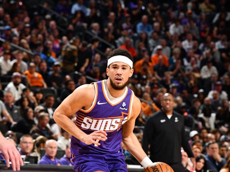 PHOENIX, AZ - FEBRUARY 13:  Devin Booker #1 of the Phoenix Suns handles the ball during the game against the Sacramento Kings on February 13, 2024 at Footprint Center in Phoenix, Arizona. NOTE TO USER: User expressly acknowledges and agrees that, by downloading and or using this photograph, user is consenting to the terms and conditions of the Getty Images License Agreement. Mandatory Copyright Notice: Copyright 2024 NBAE (Photo by Barry Gossage/NBAE via Getty Images)