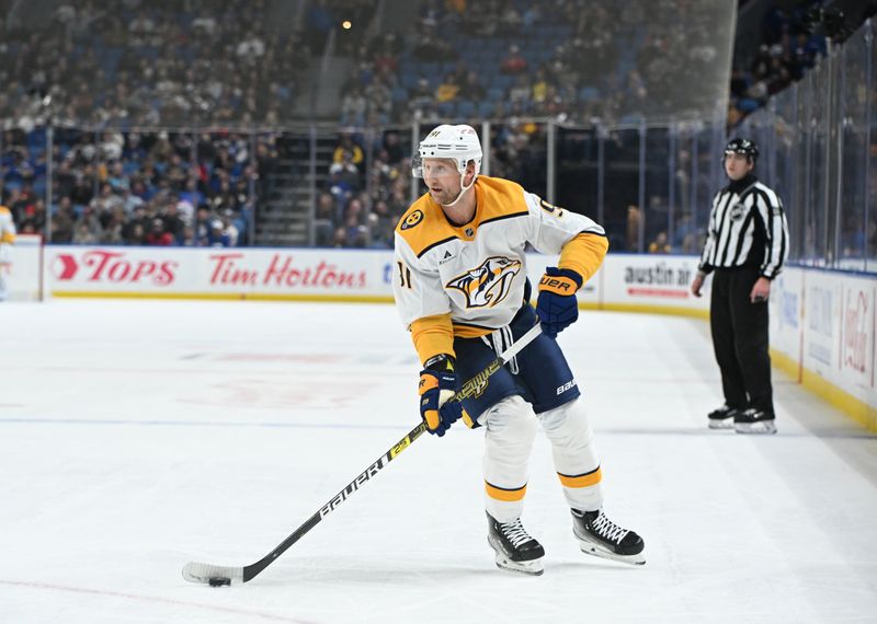 Jan 31, 2025; Buffalo, New York, USA; Nashville Predators center Steven Stamkos (91) handles the puck against the Buffalo Sabres in the first period at the KeyBank Center. Mandatory Credit: Mark Konezny-Imagn Images