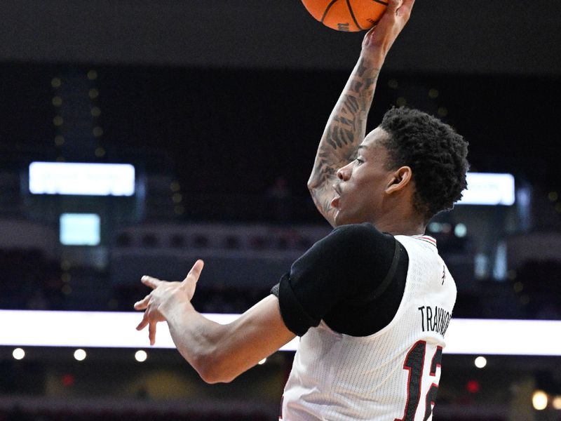 Nov 26, 2023; Louisville, Kentucky, USA;  Louisville Cardinals forward JJ Traynor (12) shoots against the New Mexico State Aggies during the second half at KFC Yum! Center. Louisville defeated New Mexico State 90-84. Mandatory Credit: Jamie Rhodes-USA TODAY Sports