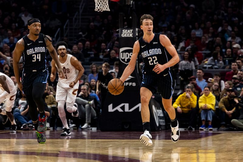 CLEVELAND, OHIO - FEBRUARY 22: Franz Wagner #22 of the Orlando Magic drives down the court during the second quarter of the game against the Cleveland Cavaliers at Rocket Mortgage Fieldhouse on February 22, 2024 in Cleveland, Ohio. NOTE TO USER: User expressly acknowledges and agrees that, by downloading and or using this photograph, User is consenting to the terms and conditions of the Getty Images License Agreement. (Photo by Lauren Leigh Bacho/Getty Images)