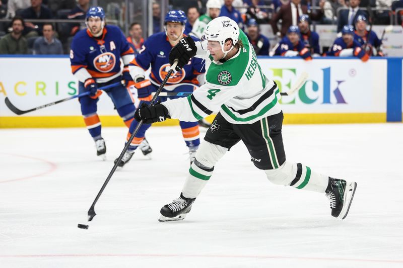 Mar 26, 2026; Elmont, New York, USA; Dallas Stars defenseman Miro Heiskanen (4) attempts a shot on goal in the third period against the New York Islanders at UBS Arena. Mandatory Credit: Wendell Cruz-Imagn Images Mar 26, 2026; Elmont, New York, USA; Dallas Stars defenseman Miro Heiskanen (4) attempts a shot on goal in the third period against the New York Islanders at UBS Arena. Mandatory Credit: Wendell Cruz-Imagn Images