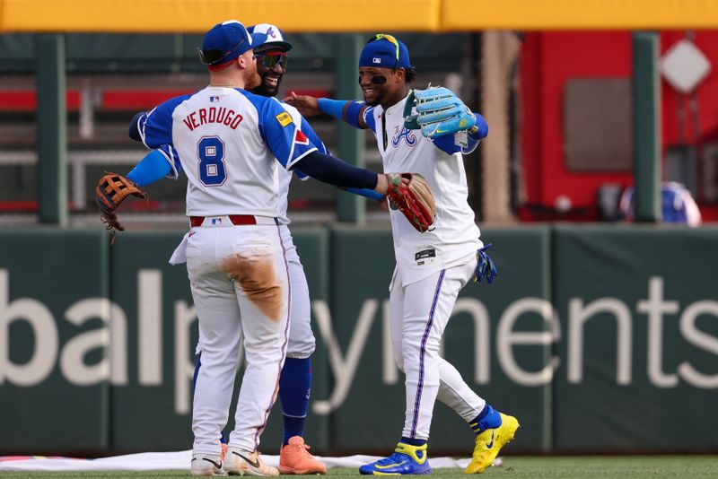 May 24, 2025; Atlanta, Georgia, USA; Atlanta Braves left fielder Alex Verdugo (8) and center fielder Michael Harris II (23) and right fielder Ronald Acuna Jr. (13) celebrate after a victory over the San Diego Padres at Truist Park. Mandatory Credit: Brett Davis-Imagn Images