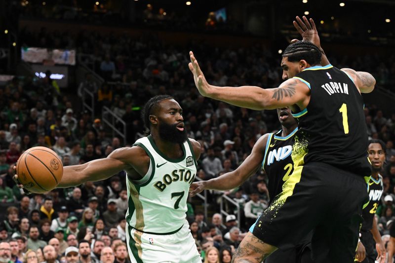 BOSTON, MASSACHUSETTS - JANUARY 30: Jaylen Brown #7 of the Boston Celtics passes around Obi Toppin #1 of the Indiana Pacers during the fourth quarter at the TD Garden on January 30, 2024 in Boston, Massachusetts. NOTE TO USER: User expressly acknowledges and agrees that, by downloading and or using this photograph, User is consenting to the terms and conditions of the Getty Images License Agreement. (Photo by Brian Fluharty/Getty Images)