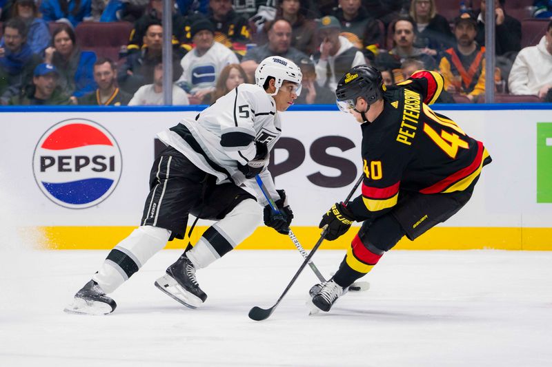 Feb 29, 2024; Vancouver, British Columbia, CAN; Los Angeles Kings forward Quinton Byfield (55) drives around Vancouver Canucks forward Elias Pettersson (40) in the second period at Rogers Arena. Mandatory Credit: Bob Frid-USA TODAY Sports