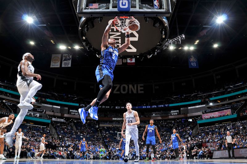 ORLANDO, FL - FEBRUARY 8: Paolo Banchero #5 of the Orlando Magic dunks the ball during the game against the San Antonio Spurs on February 8, 2024 at the Kia Center in Orlando, Florida. NOTE TO USER: User expressly acknowledges and agrees that, by downloading and or using this photograph, User is consenting to the terms and conditions of the Getty Images License Agreement. Mandatory Copyright Notice: Copyright 2024 NBAE (Photo by Fernando Medina/NBAE via Getty Images)