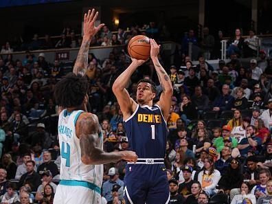 DENVER, CO - JANUARY 1: Michael Porter Jr. #1 of the Denver Nuggets shoots the ball during the game against the Charlotte Hornets on January 1, 2024 at the Ball Arena in Denver, Colorado. NOTE TO USER: User expressly acknowledges and agrees that, by downloading and/or using this Photograph, user is consenting to the terms and conditions of the Getty Images License Agreement. Mandatory Copyright Notice: Copyright 2024 NBAE (Photo by Bart Young/NBAE via Getty Images)