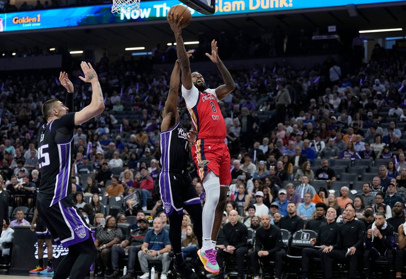 SACRAMENTO, CALIFORNIA - APRIL 11: Naji Marshall #8 of the New Orleans Pelicans shoots over Davion Mitchell #15 of the Sacramento Kings during the first half of an NBA basketball game at Golden 1 Center on April 11, 2024 in Sacramento, California. NOTE TO USER: User expressly acknowledges and agrees that, by downloading and or using this photograph, User is consenting to the terms and conditions of the Getty Images License Agreement. (Photo by Thearon W. Henderson/Getty Images)