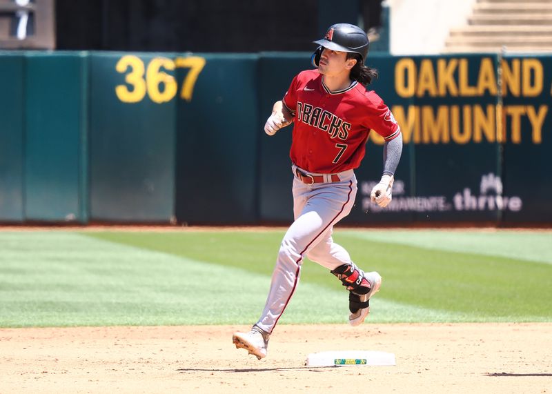 May 17, 2023; Oakland, California, USA; Arizona Diamondbacks right fielder Corbin Carroll (7) rounds the bases after hitting a two-run home run against the Oakland Athletics during the sixth inning at Oakland-Alameda County Coliseum. Mandatory Credit: Kelley L Cox-USA TODAY Sports