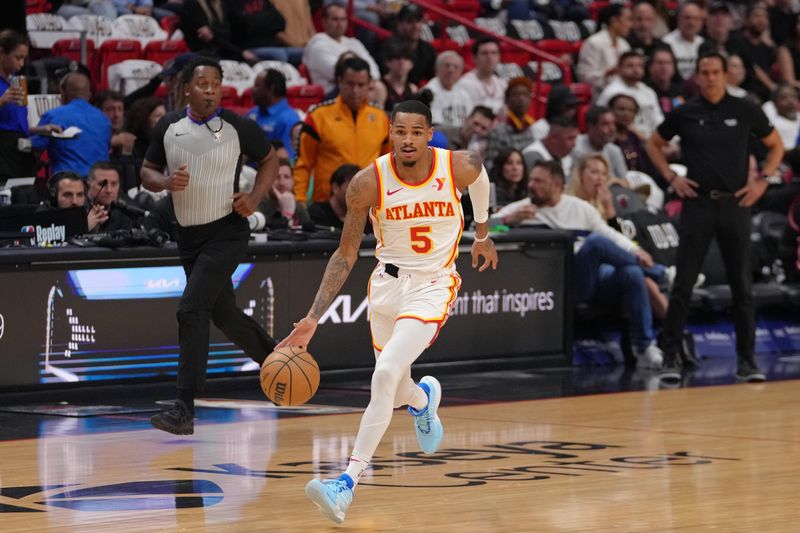 MIAMI, FL - JANUARY 19: Dejounte Murray #5 of the Atlanta Hawks dribbles the ball during the game against the Miami Heat on January 19, 2024 at Kaseya Center in Miami, Florida. NOTE TO USER: User expressly acknowledges and agrees that, by downloading and or using this Photograph, user is consenting to the terms and conditions of the Getty Images License Agreement. Mandatory Copyright Notice: Copyright 2024 NBAE (Photo by Eric Espada/NBAE via Getty Images)