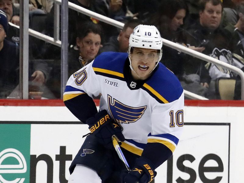 Dec 3, 2022; Pittsburgh, Pennsylvania, USA;  St. Louis Blues center Brayden Schenn (10) skates up ice with the puck against the Pittsburgh Penguins during the third period at PPG Paints Arena. The Penguins won 6-2. Mandatory Credit: Charles LeClaire-USA TODAY Sports