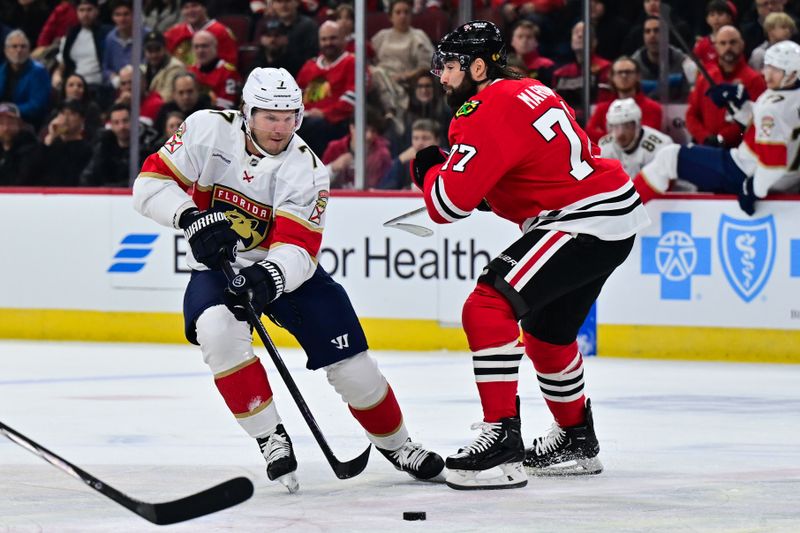 Nov 21, 2024; Chicago, Illinois, USA; Florida Panthers defenseman Dmitry Kulikov (7) plays the puck as Chicago Blackhawks left wing Pat Maroon (77) defends during the first period at the United Center. Mandatory Credit: Daniel Bartel-Imagn Images