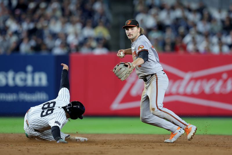 Sep 25, 2024; Bronx, New York, USA; Baltimore Orioles shortstop Gunnar Henderson (2) looks to first base after forcing out New York Yankees left fielder Jasson Dominguez (89) at second base on a ground ball fielder's choice by Yankees shortstop Anthony Volpe (not pictured) during the sixth inning at Yankee Stadium. Mandatory Credit: Brad Penner-Imagn Images