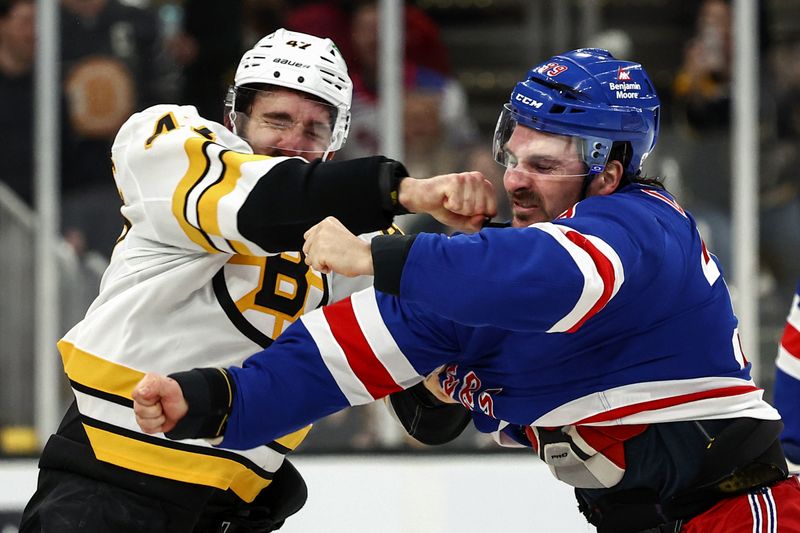 Jan 10, 2026; Boston, Massachusetts, USA; Boston Bruins center Mark Kastelic (47) fights with New York Rangers center Sam Carrick (39) during the second period at TD Garden. Mandatory Credit: Winslow Townson-Imagn Images