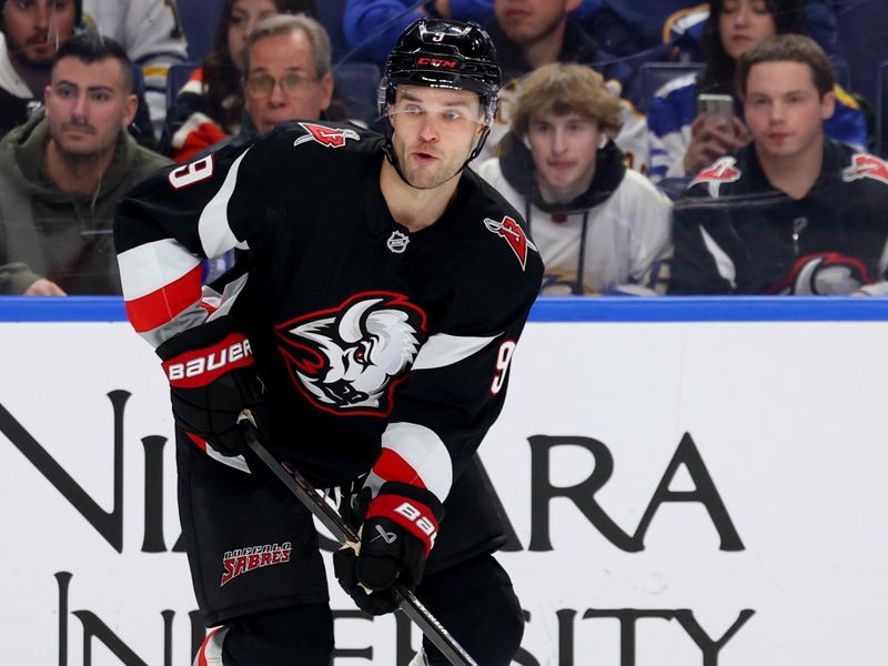 Dec 18, 2025; Buffalo, New York, USA;  Buffalo Sabres center Josh Norris (9) looks to make a pass during the second period against the Philadelphia Flyers at KeyBank Center. Mandatory Credit: Timothy T. Ludwig-Imagn Images