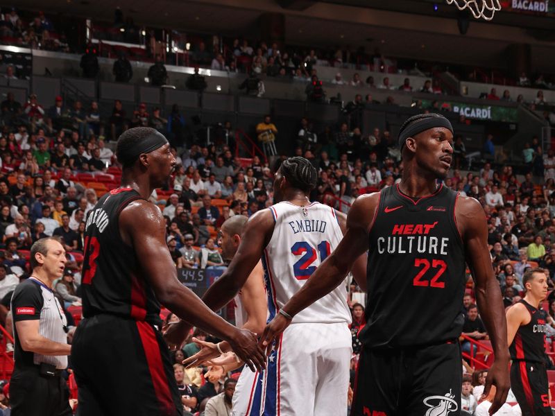 MIAMI, FL - APRIL 4: Jimmy Butler #22 of the Miami Heat high fives Bam Adebayo #13 during the game against the Philadelphia 76ers on April 4, 2024 at Kaseya Center in Miami, Florida. NOTE TO USER: User expressly acknowledges and agrees that, by downloading and or using this Photograph, user is consenting to the terms and conditions of the Getty Images License Agreement. Mandatory Copyright Notice: Copyright 2024 NBAE (Photo by Issac Baldizon/NBAE via Getty Images)