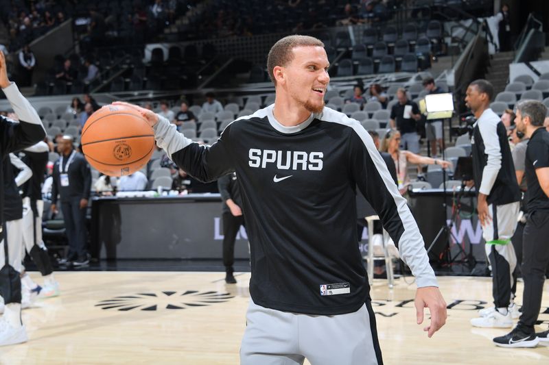 SAN ANTONIO, TX - OCTOBER 7: Malachi Flynn #18 of the San Antonio Spurs smiles before the game against the Oklahoma City Thunder during a NBA preseason game on October 7, 2024 at the Frost Bank Center in San Antonio, Texas. NOTE TO USER: User expressly acknowledges and agrees that, by downloading and or using this photograph, user is consenting to the terms and conditions of the Getty Images License Agreement. Mandatory Copyright Notice: Copyright 2024 NBAE (Photos by Michael Gonzales/NBAE via Getty Images)