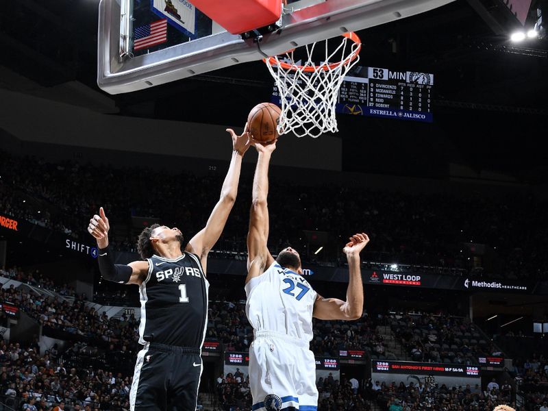 SAN ANTONIO, TX - NOVEMBER 2: Victor Wembanyama #1 of the San Antonio Spurs and Rudy Gobert #27 of the Minnesota Timberwolves go up for the rebound during the game on November 2, 2024 at the Frost Bank Center in San Antonio, Texas. NOTE TO USER: User expressly acknowledges and agrees that, by downloading and or using this photograph, user is consenting to the terms and conditions of the Getty Images License Agreement. Mandatory Copyright Notice: Copyright 2024 NBAE (Photos by Michael Gonzales/NBAE via Getty Images)