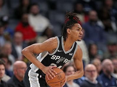 MEMPHIS, TENNESSEE - JANUARY 02: Devin Vassell #24 of the San Antonio Spurs handles the ball during the game against the Memphis Grizzlies at FedExForum on January 02, 2024 in Memphis, Tennessee. NOTE TO USER: User expressly acknowledges and agrees that, by downloading and or using this photograph, User is consenting to the terms and conditions of the Getty Images License Agreement. (Photo by Justin Ford/Getty Images)