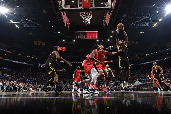 SAN FRANCISCO, CA - DECEMBER 23: Kevon Looney #5 of the Golden State Warriors grabs a rebound during the game against the Portland Trail Blazers on December 23, 2023 at Chase Center in San Francisco, California. NOTE TO USER: User expressly acknowledges and agrees that, by downloading and or using this photograph, user is consenting to the terms and conditions of Getty Images License Agreement. Mandatory Copyright Notice: Copyright 2023 NBAE (Photo by Noah Graham/NBAE via Getty Images)