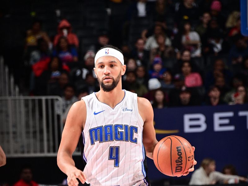 DETROIT, MI - FEBRUARY 4: Jalen Suggs #4 of the Orlando Magic handles the ball during the game  against the Detroit Pistons on February 4, 2024 at Little Caesars Arena in Detroit, Michigan. NOTE TO USER: User expressly acknowledges and agrees that, by downloading and/or using this photograph, User is consenting to the terms and conditions of the Getty Images License Agreement. Mandatory Copyright Notice: Copyright 2024 NBAE (Photo by Chris Schwegler/NBAE via Getty Images)