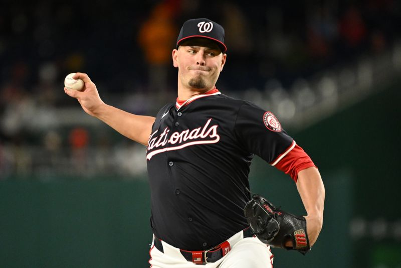 Apr 5, 2024; Washington, District of Columbia, USA; Washington Nationals relief pitcher Tanner Rainey (21) throws a pitch against the Philadelphia Phillies during the eighth inning at Nationals Park. Mandatory Credit: Rafael Suanes-USA TODAY Sports