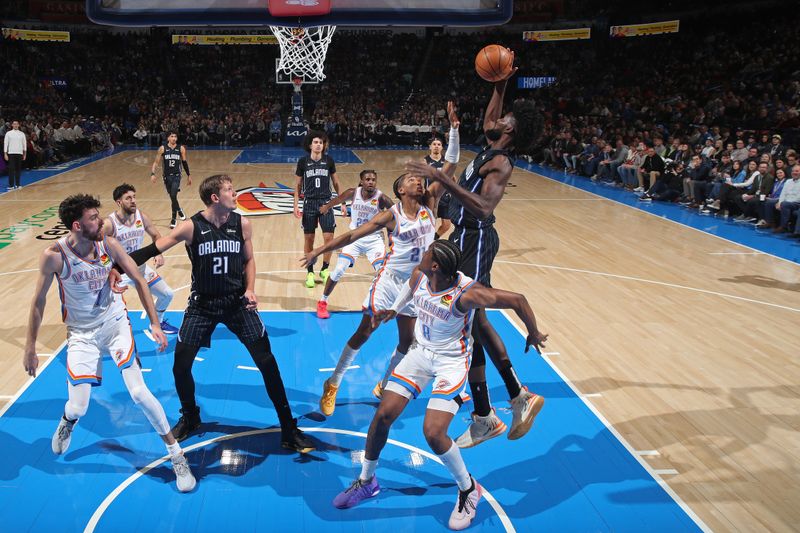 OKLAHOMA CITY, OK - JANUARY 13: Jonathan Isaac #1 of the Orlando Magic rebounds during the game against the Oklahoma City Thunder on January 13, 2024 at Paycom Arena in Oklahoma City, Oklahoma. NOTE TO USER: User expressly acknowledges and agrees that, by downloading and or using this photograph, User is consenting to the terms and conditions of the Getty Images License Agreement. Mandatory Copyright Notice: Copyright 2024 NBAE (Photo by Zach Beeker/NBAE via Getty Images)