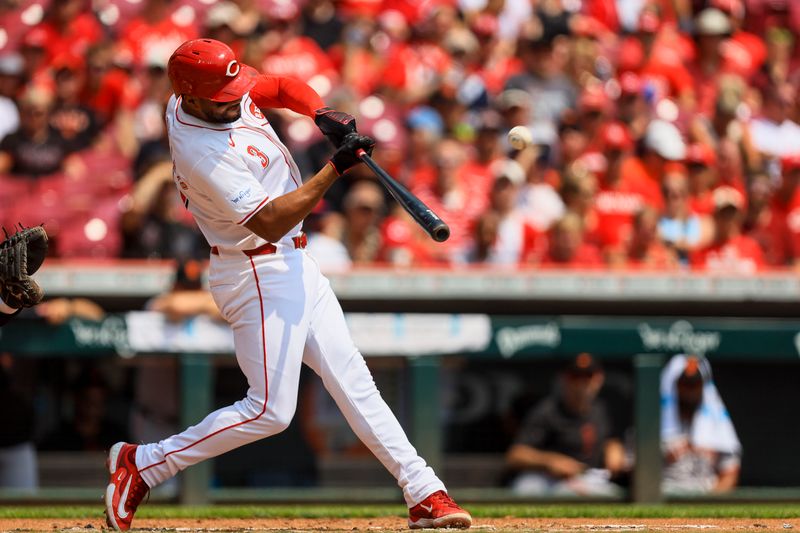 Aug 4, 2024; Cincinnati, Ohio, USA; Cincinnati Reds designated hitter Jeimer Candelario (3) hits a solo home run in the second inning against the San Francisco Giants at Great American Ball Park. Mandatory Credit: Katie Stratman-USA TODAY Sports