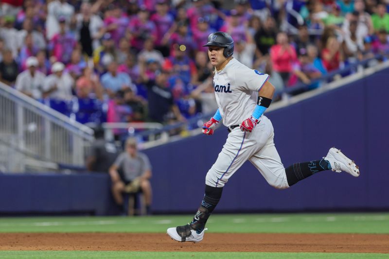 Jul 30, 2023; Miami, Florida, USA; Miami Marlins right fielder Avisail Garcia (24) runs toward third base after hitting a triple against the Detroit Tigers during the fifth inning at loanDepot Park. Mandatory Credit: Sam Navarro-USA TODAY Sports