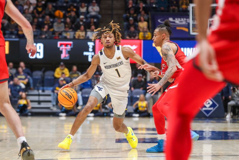 Mar 2, 2024; Morgantown, West Virginia, USA; West Virginia Mountaineers guard Noah Farrakhan (1) dribbles during the second half against the Texas Tech Red Raiders at WVU Coliseum. Mandatory Credit: Ben Queen-USA TODAY Sports