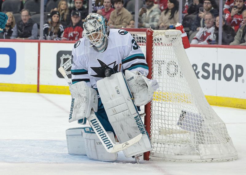 Dec 1, 2023; Newark, New Jersey, USA; San Jose Sharks goaltender Kaapo Kahkonen (36) makes a save during the third period against the New Jersey Devils at Prudential Center. Mandatory Credit: Vincent Carchietta-USA TODAY Sports