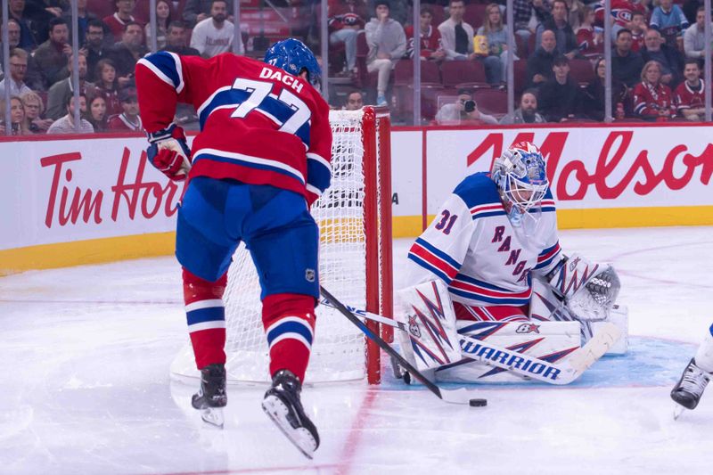 Oct 22, 2024; Ottawa, Ontario, CAN; New York Rangers goalie Igor Shesterkin (31) makes a save in front of  Montreal Canadiens center Kirby Dach (77) in the second period at the Bell Centre. Mandatory Credit: Marc DesRosiers-Imagn Images