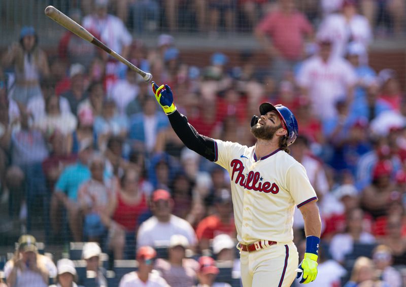 Aug 13, 2023; Philadelphia, Pennsylvania, USA; Philadelphia Phillies designated hitter Bryce Harper (3) tosses his bat in the air after being called out looking on a strike during the eighth inning at Citizens Bank Park. Mandatory Credit: Bill Streicher-USA TODAY Sports