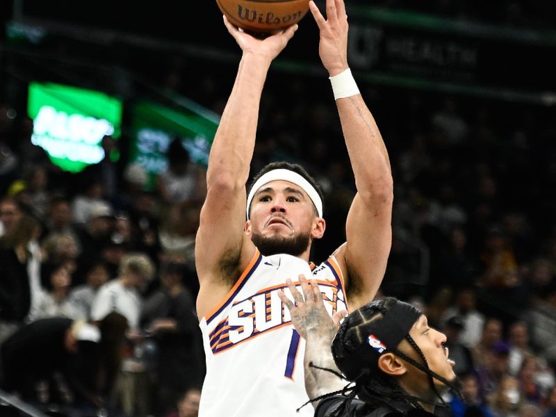 SALT LAKE CITY, UTAH - NOVEMBER 12: Devin Booker #1 of the Phoenix Suns shoots over Jordan Clarkson #00 of the Utah Jazz during the second half of a Emirates NBA Cup game at Delta Center on November 12, 2024 in Salt Lake City, Utah. NOTE TO USER: User expressly acknowledges and agrees that, by downloading and or using this photograph, User is consenting to the terms and conditions of the Getty Images License Agreement. (Photo by Alex Goodlett/Getty Images)