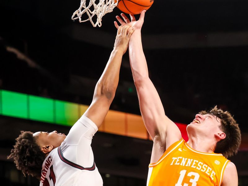 Mar 3, 2026; Columbia, South Carolina, USA; Tennessee Volunteers forward J.P. Estrella (13) shoots over South Carolina Gamecocks forward Elijah Strong (31) in the second half at Colonial Life Arena. Mandatory Credit: Jeff Blake-Imagn Images