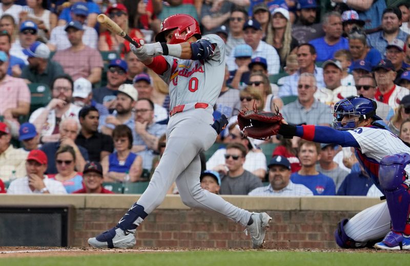 Aug 4, 2024; Chicago, Illinois, USA; St. Louis Cardinals shortstop Masyn Winn (0) hits a two-run home run against the Chicago Cubs during the third inning at Wrigley Field. Mandatory Credit: David Banks-USA TODAY Sports