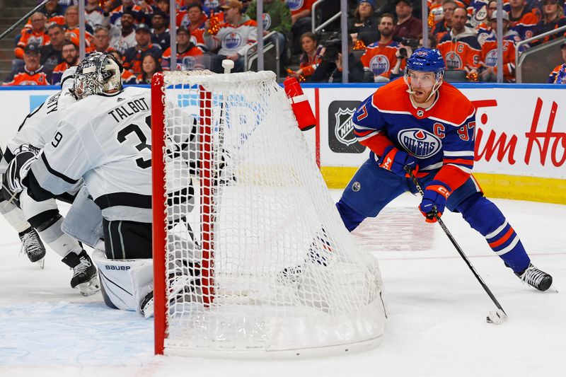 Apr 22, 2024; Edmonton, Alberta, CAN; Edmonton Oilers forward Connor McDavid (97) looks to make a pass in front of Los Angeles Kings goaltender Cam Talbot (39) during the third period in game one of the first round of the 2024 Stanley Cup Playoffs at Rogers Place. Mandatory Credit: Perry Nelson-USA TODAY Sports