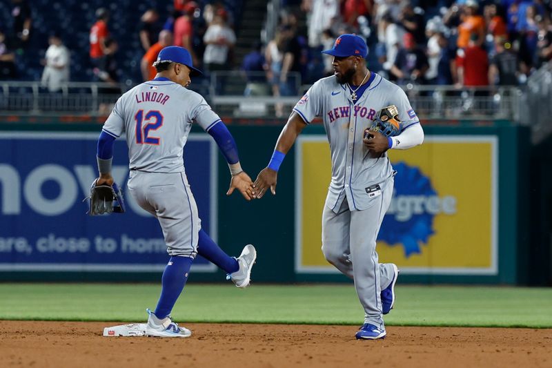 Jun 3, 2024; Washington, District of Columbia, USA; New York Mets shortstop Francisco Lindor (12) and Mets outfielder Starling Marte (6) celebrate after their game against the Washington Nationals at Nationals Park. Mandatory Credit: Geoff Burke-USA TODAY Sports