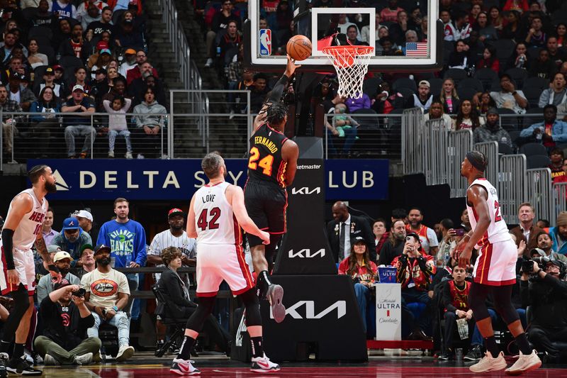 ATLANTA, GA - APRIL 9: Bruno Fernando #24 of the Atlanta Hawks shoots the ball during the game against the Miami Heat on April 9, 2024 at State Farm Arena in Atlanta, Georgia.  NOTE TO USER: User expressly acknowledges and agrees that, by downloading and/or using this Photograph, user is consenting to the terms and conditions of the Getty Images License Agreement. Mandatory Copyright Notice: Copyright 2024 NBAE (Photo by Scott Cunningham/NBAE via Getty Images)