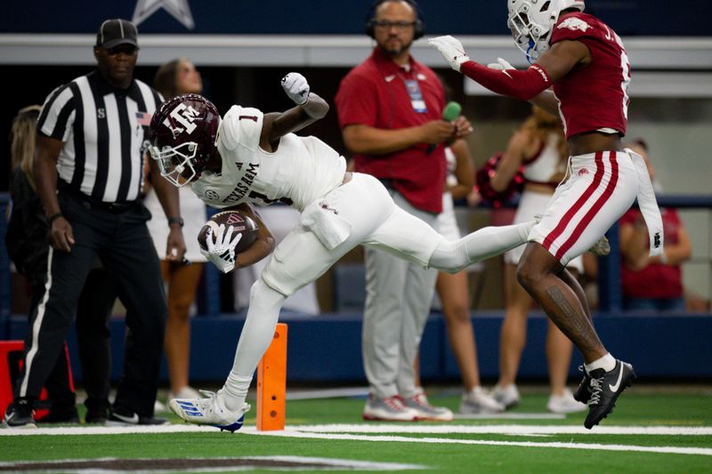 Sep 30, 2023; Arlington, Texas, USA; Texas A&M Aggies wide receiver Evan Stewart (1) catches a pass for a touchdown against the Arkansas Razorbacks during the first half at AT&T Stadium. Mandatory Credit: Jerome Miron-USA TODAY Sports