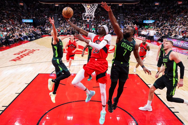 TORONTO, CANADA - JANUARY 15: Chris Boucher #25 of the Toronto Raptors drives to the basket during the game against the Boston Celtics on January 15, 2025 at the Scotiabank Arena in Toronto, Ontario, Canada.  NOTE TO USER: User expressly acknowledges and agrees that, by downloading and or using this Photograph, user is consenting to the terms and conditions of the Getty Images License Agreement.  Mandatory Copyright Notice: Copyright 2025 NBAE (Photo by Vaughn Ridley/NBAE via Getty Images)