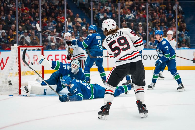 Nov 5, 2025; Vancouver, British Columbia, CAN; Chicago Blackhawks forward Tyler Bertuzzi (59) scores his third goal of the period against the Vancouver Canucks in the third period at Rogers Arena. Mandatory Credit: Bob Frid-Imagn Images