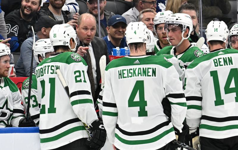 Feb 7, 2024; Toronto, Ontario, CAN; Dallas Stars assistant coach Steve Spott speaks with his players during a time out against the Toronto Maple Leafs in the third period at Scotiabank Arena. Mandatory Credit: Dan Hamilton-USA TODAY Sports